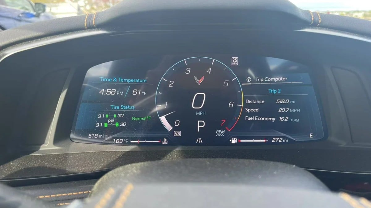 Digital instrument cluster of Chevrolet Corvette showing 61°F temperature, tire status, and 16.2 MPG fuel economy at 4:58 PM.