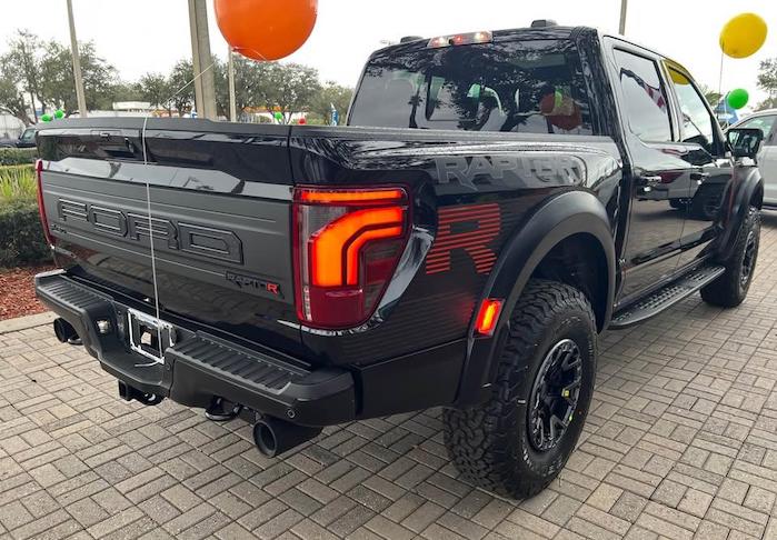 The 2025 Ford-F150 Raptor R rear view at the dealer