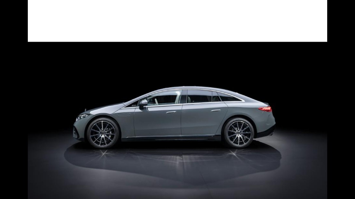 2025 Mercedes EQS in gray, side view showcasing distinctive wheels and streamlined body design.
