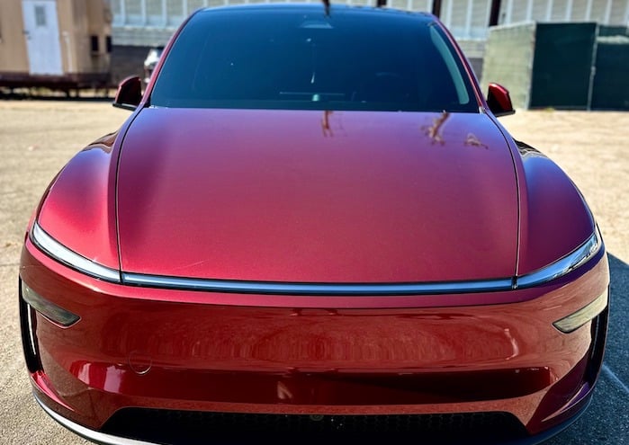 Kenny's 2025 Tesal Model Y front view with Metallic Redhood PPF