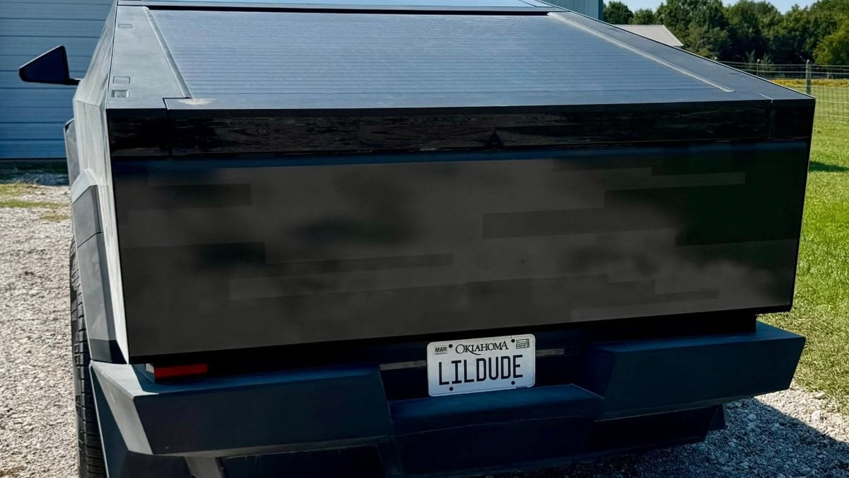 Rear view of a black vehicle with an Oklahoma license plate reading &quot;LILDUDE.&quot;