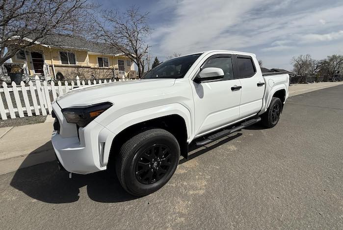 Carla's 2024 Toyota Tacoma outside her house