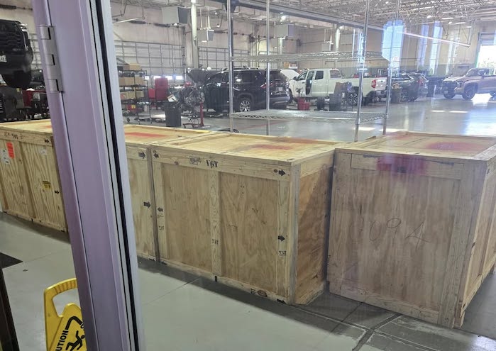 Toyota replacement engines in crates at the dealer's service department