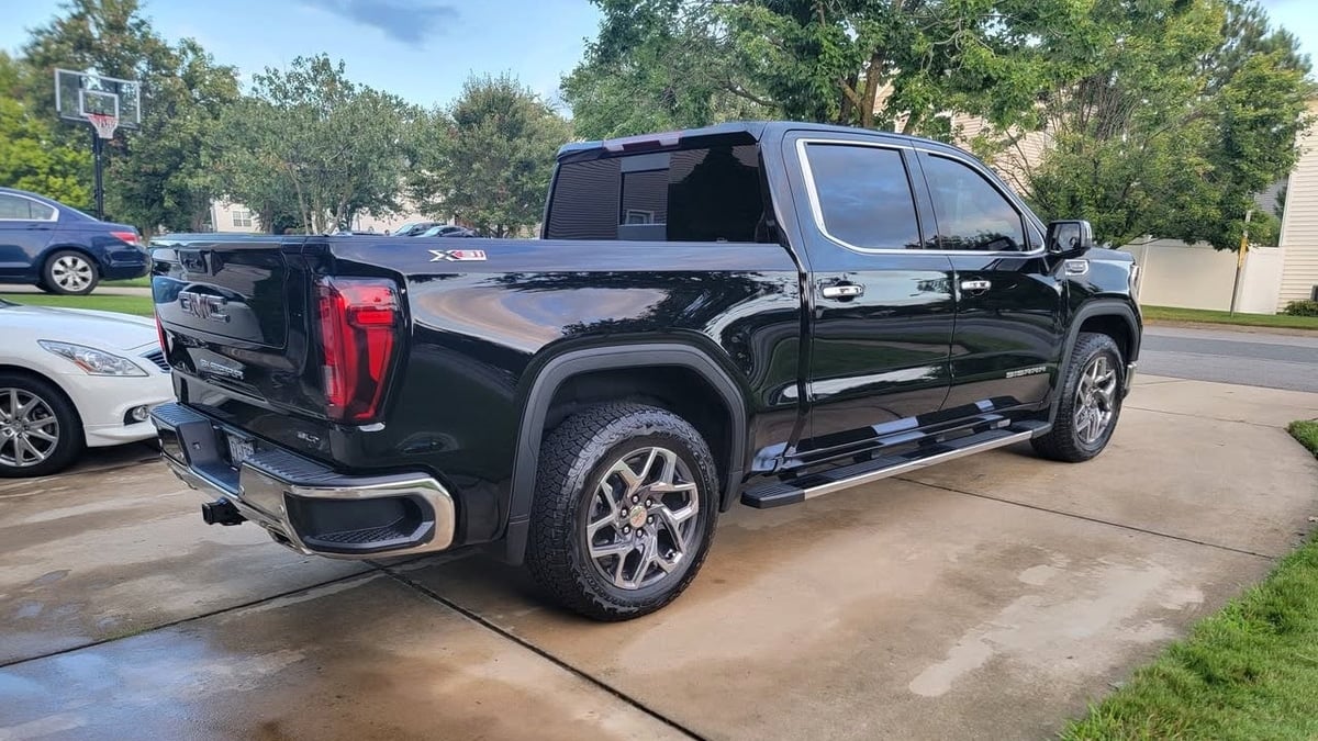 2025 GMC Sierra 1500 SLT in a driveway in North Carolina rear view