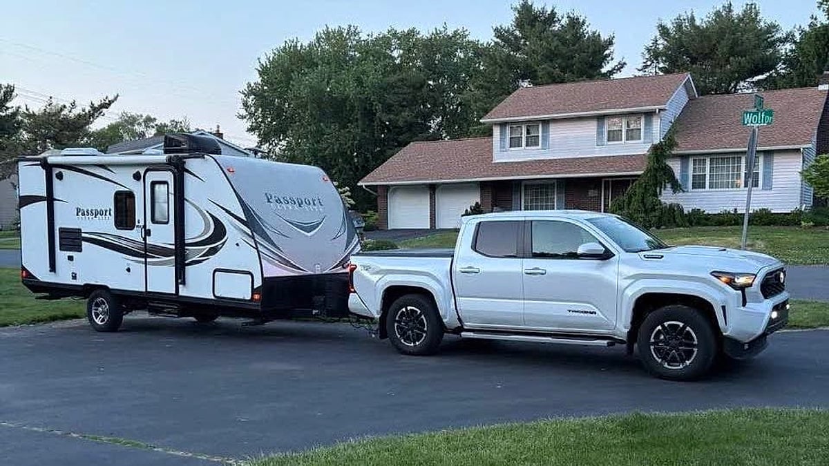Guy Edwards' 2025 Toyota Tacoma TRD Sport pulling a travel trailer