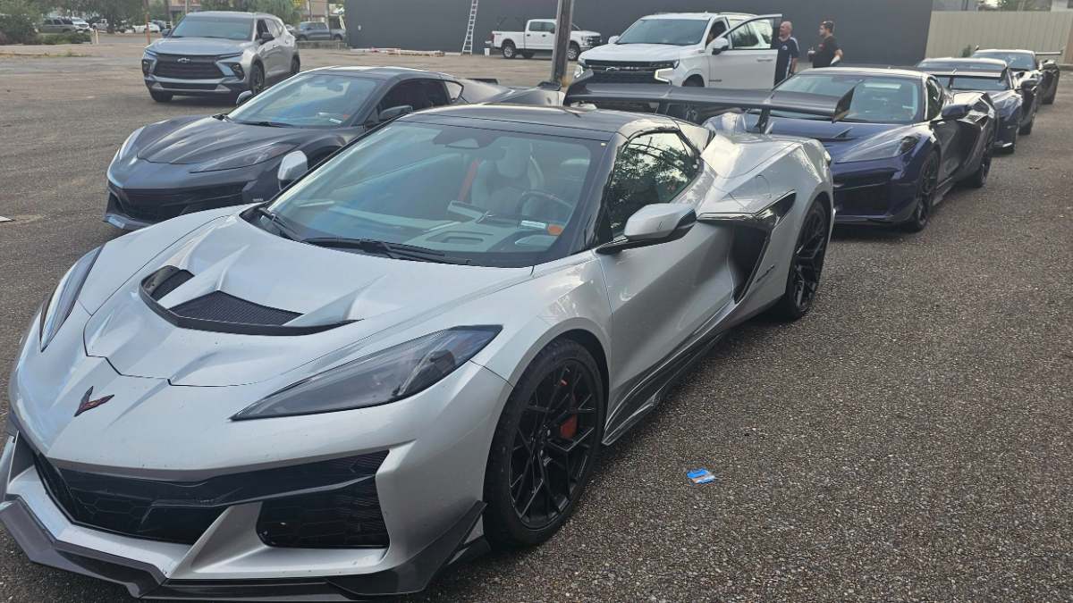 Line of Chevrolet Corvette Z06 sports cars parked in a lot, silver model in front