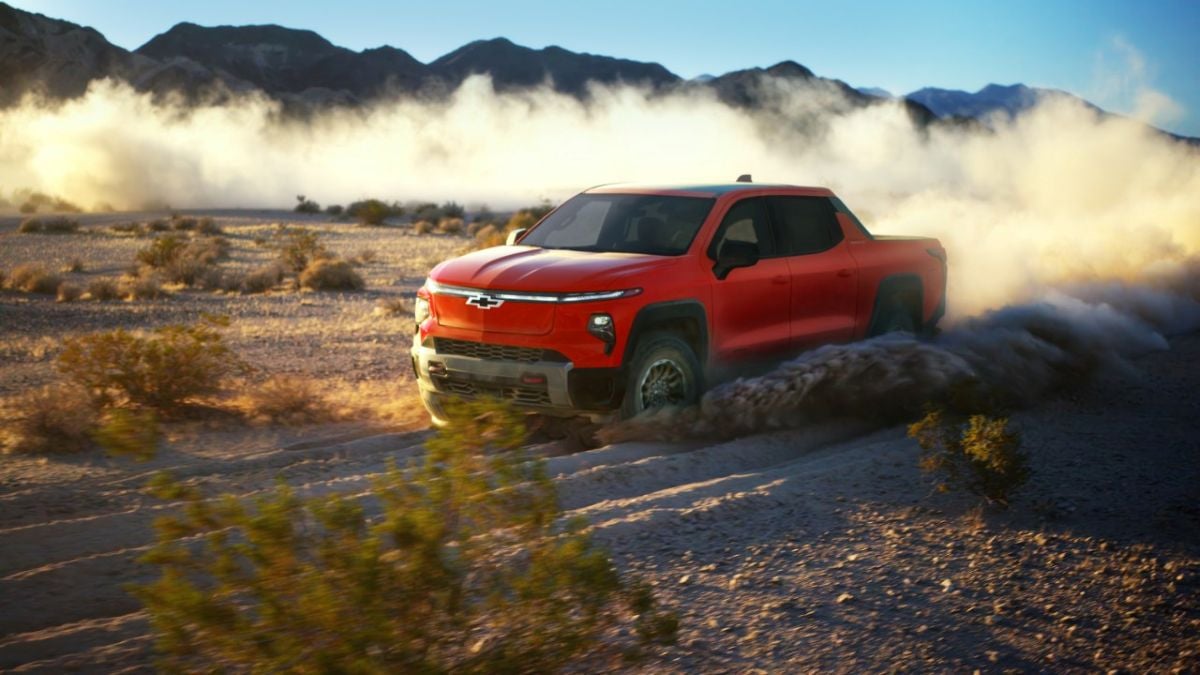 Red 2026 Chevy Silverado EV Trail Boss on dirt road