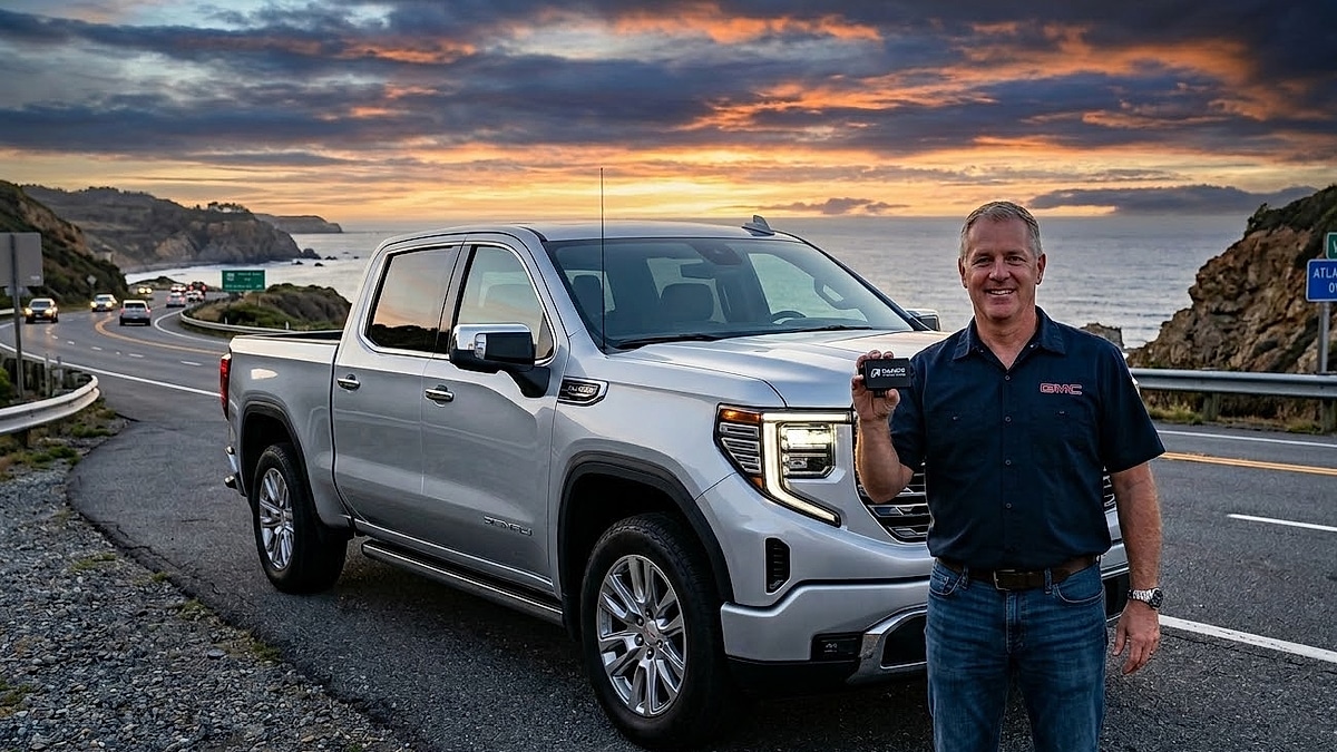 2026 GMC Sierra 1500 owner holds a Range Technology module to disable auto-stop and improve V8 engine reliability