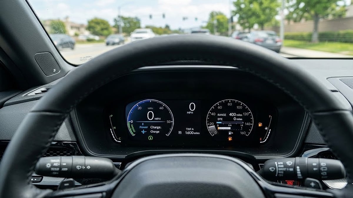 2026 Honda CR-V Hybrid AWD Sport-L instrument cluster showing 400 miles range, 1600 miles total, with low fuel warning