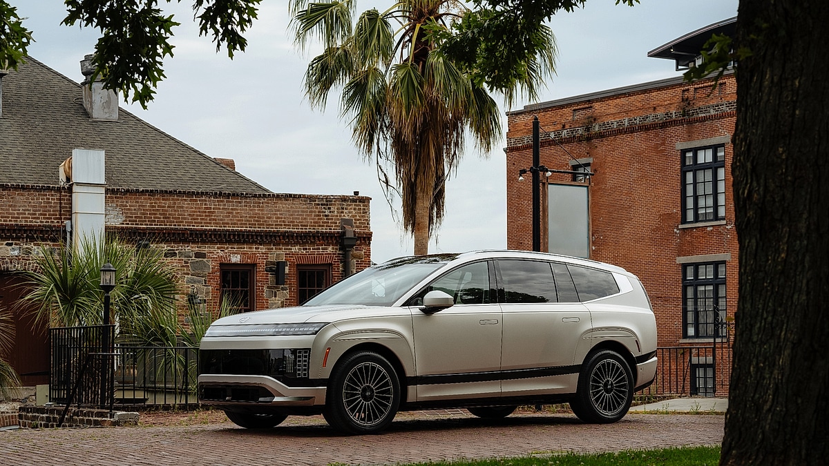 2026 Hyundai Ioniq 9 electric SUV in silver parked in an urban setting, low-angle front three-quarter view