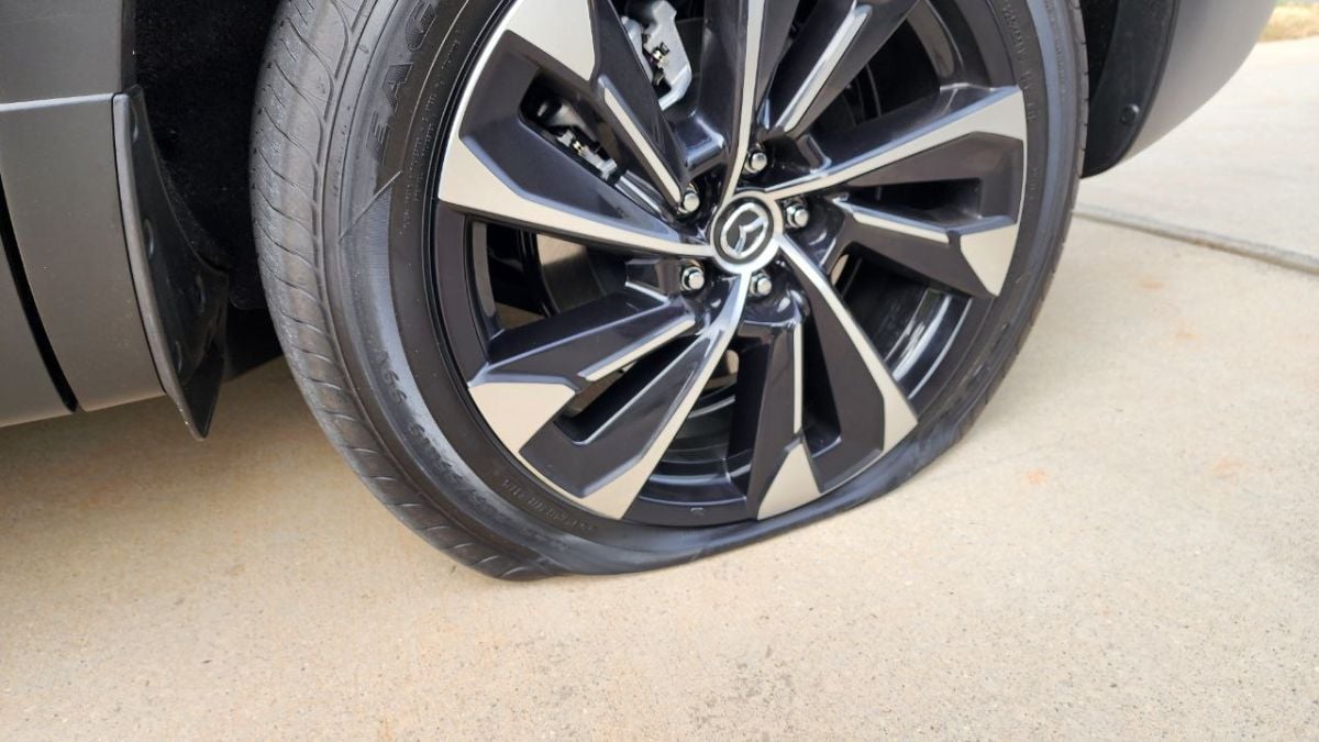 2026 Mazda CX-50 Hybrid with a flat tire