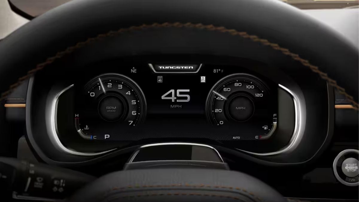 2026 Ram 1500 digital instrument cluster display a dashboard with illuminated gauges including tachometer, speedometer reading 45 mph, and temperature gauge showing 81°F, with a push-button start visible below.