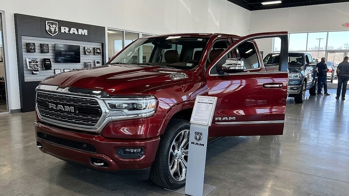 2026 Ram Longhorn truck with a detailed brown leather interior on display in a dealership showroom
