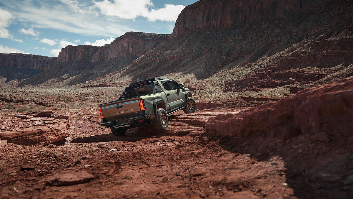 2026 Toyota Tacoma Trailhunter pickup climbing rocky desert trail off road