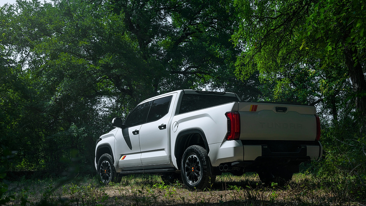2026 Toyota Tundra TRD Rally Package rear three quarter view in forest