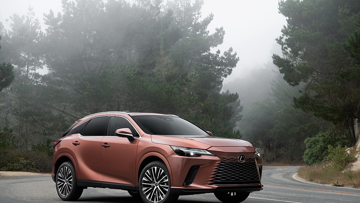 Copper 2026 Lexus RX on a foggy road, front three-quarter view