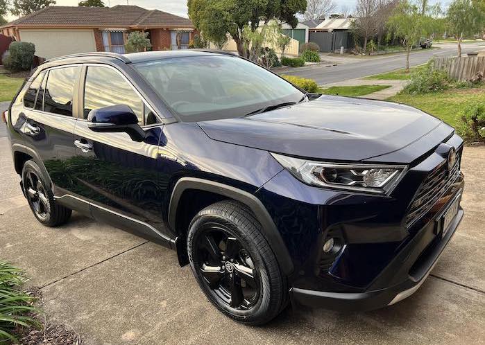 Kazi 2024 Toyota RAV4 in the driveway