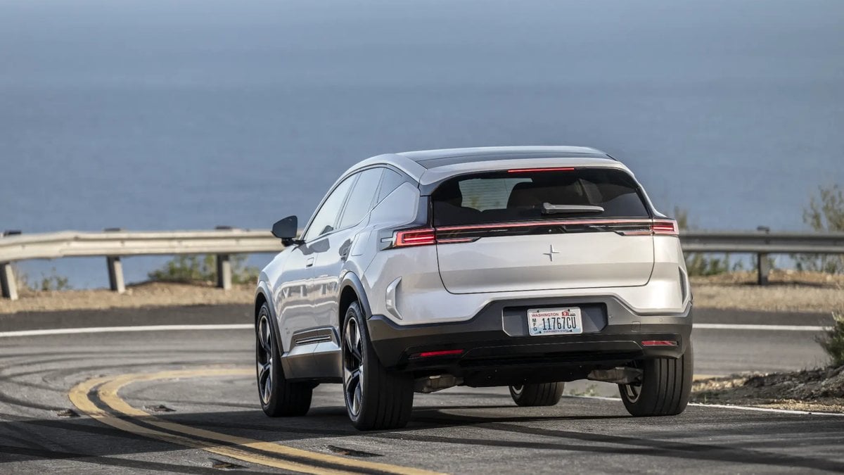 2025 Polestar 3 Long Range Single Motor rear view driving on coastal highway with modern LED taillight strip