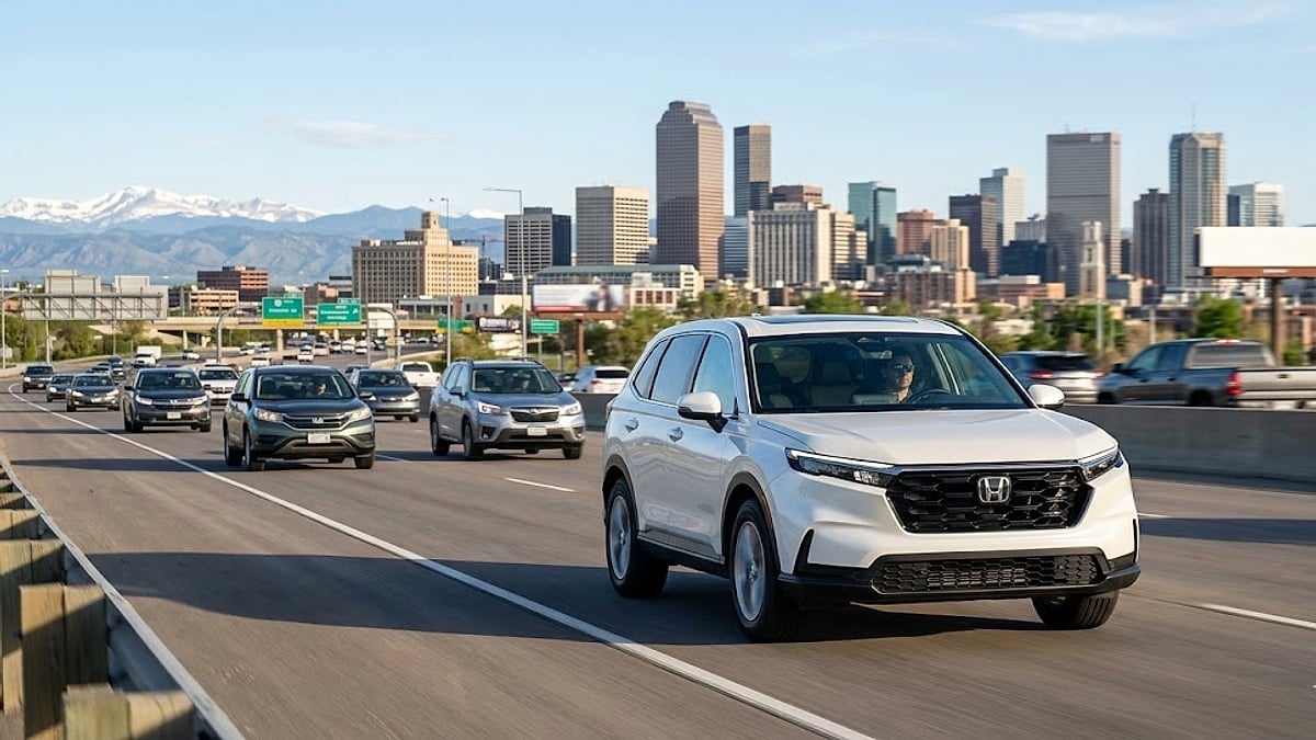 A 2024 Honda CR-V commutes on a Denver highway, symbolizing the daily driving impacted by the recent steering recall issues