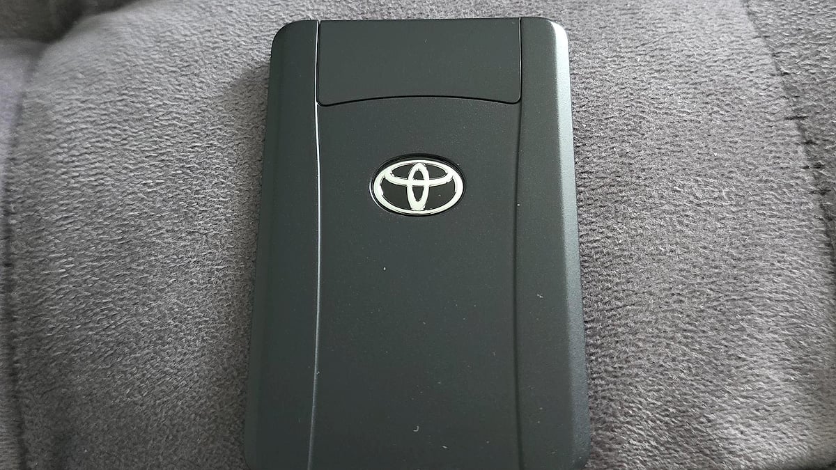 A 2025 Toyota Tacoma owner's wallet stores the ultra-slim Digital Key Card, enabling automatic door unlocking via Near Field Communication