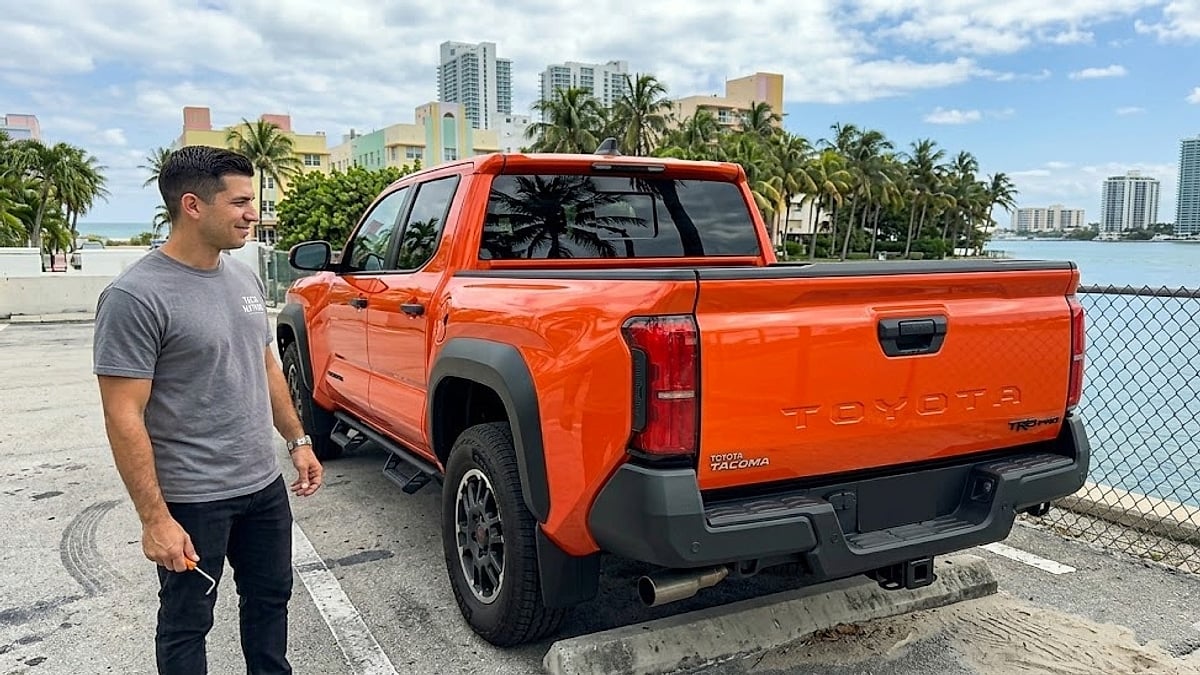 A Miami 2025 Toyota Tacoma owner demonstrating the critical, low-cost _back-in_ strategy to protect his $6,000 tailgate from 60-second thefts