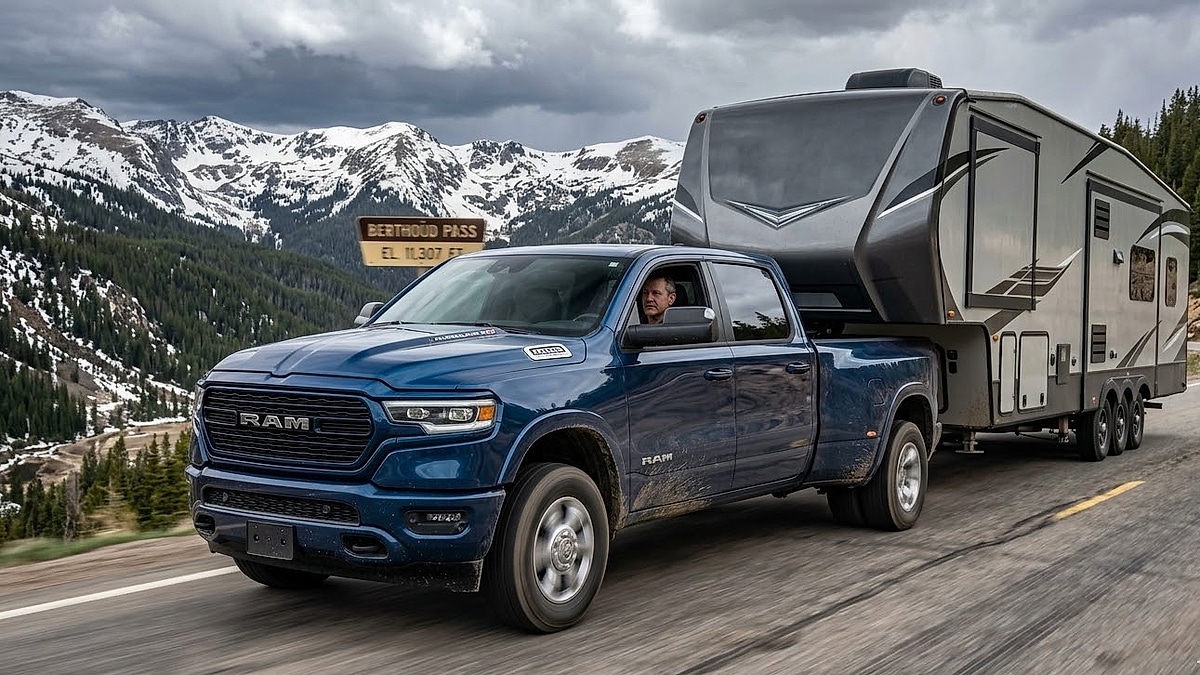 A veteran truck tester’s candid photo of the 2026 Ram Hurricane High Output climbing a steep Colorado mountain pass while towing a heavy triple-axle fifth-wheel camper near Berthoud Pass