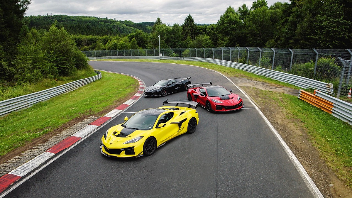 Three Chevrolet Corvette sports cars driving on the Nurburgring racetrack