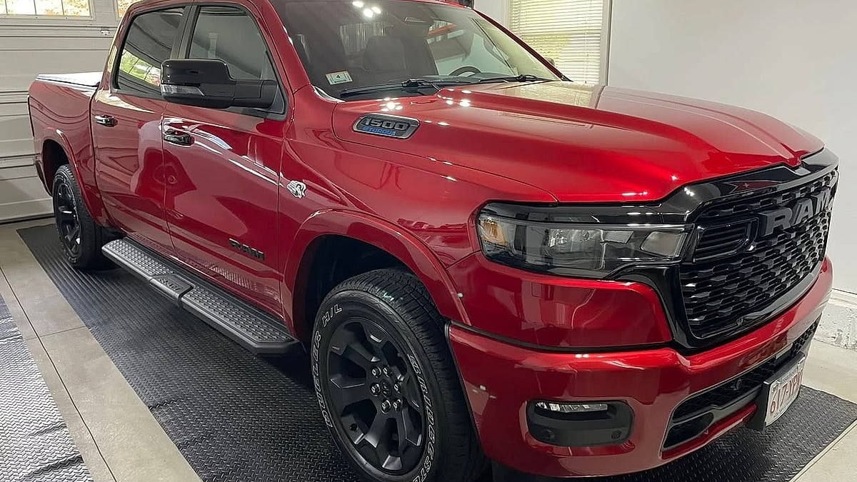 Christopher Barney's 2026 Molten Red 2026 Ram Big Horn front view in his garage