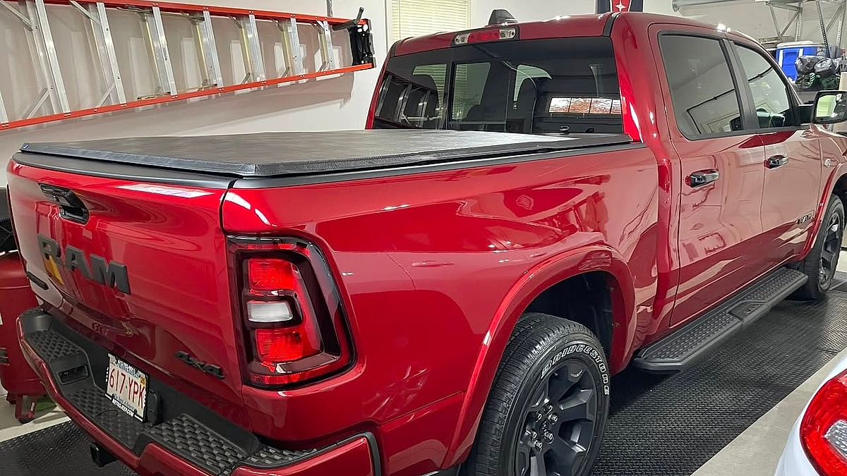 Christopher Barney's 2026 Molten Red 2026 Ram Big Horn rear view in his garage