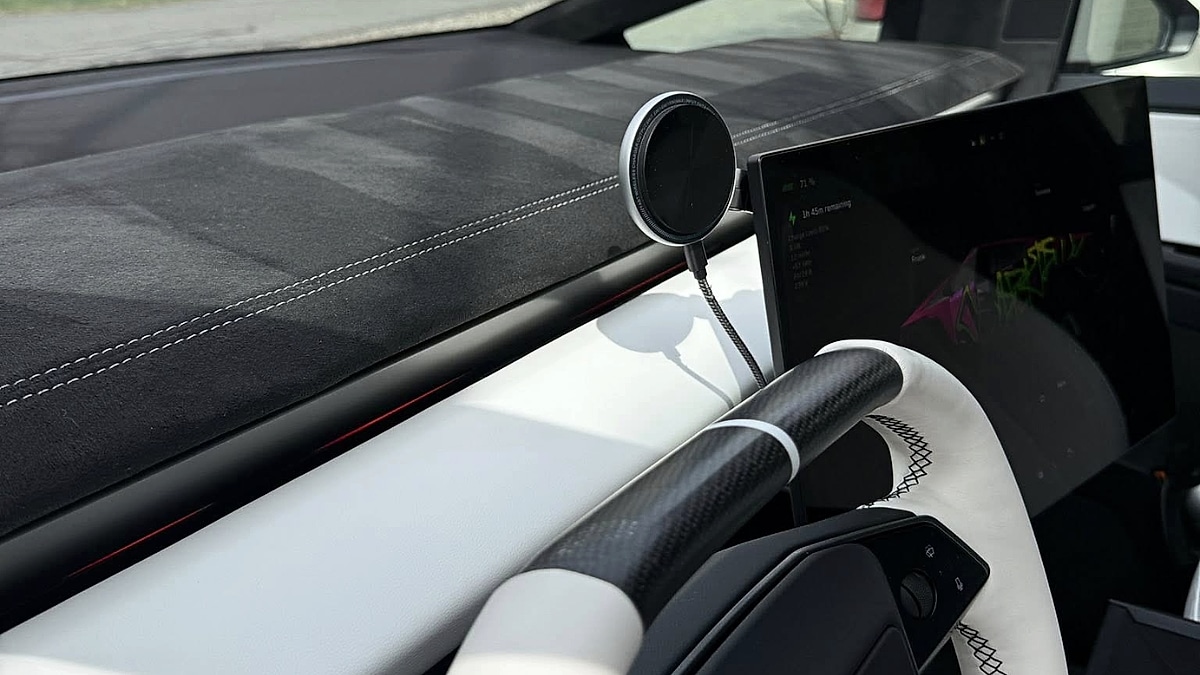 Cybertruck's custom Alcantara and white stitch dash and arm rest.