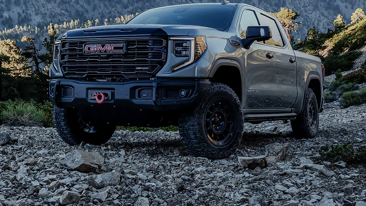 GMC Sierra 1500 AT4 AEV Edition pickup truck parked on rocky terrain