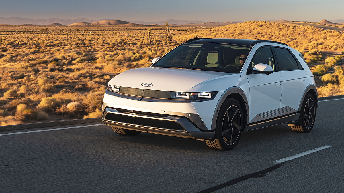 Hyundai Ioniq 5 electric crossover front view driving on highway