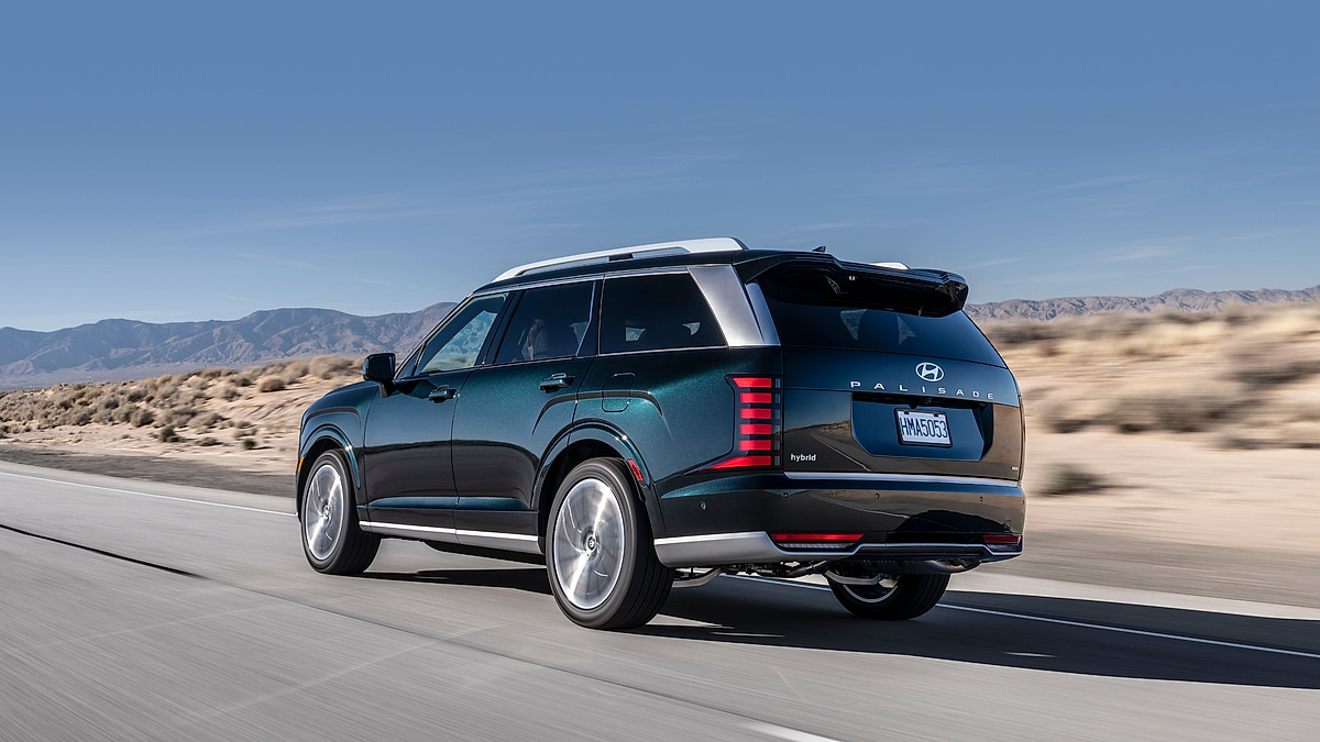 Hyundai Palisade rear three quarter view driving on highway