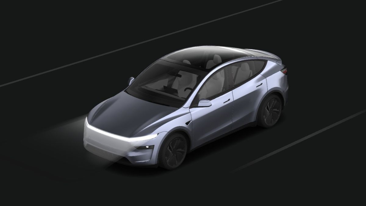 A silver Tesla Model Y model on the app with a smooth, aerodynamic design drives on a dark road. Headlights illuminate the path, conveying a futuristic tone.