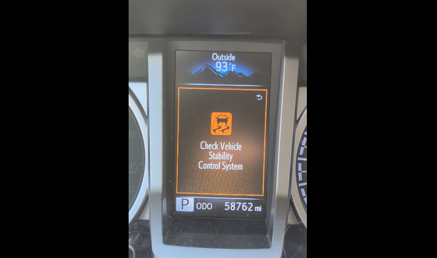 Jack's Toyota Tacoma's screen gives hims the check vehicle stability control system message.