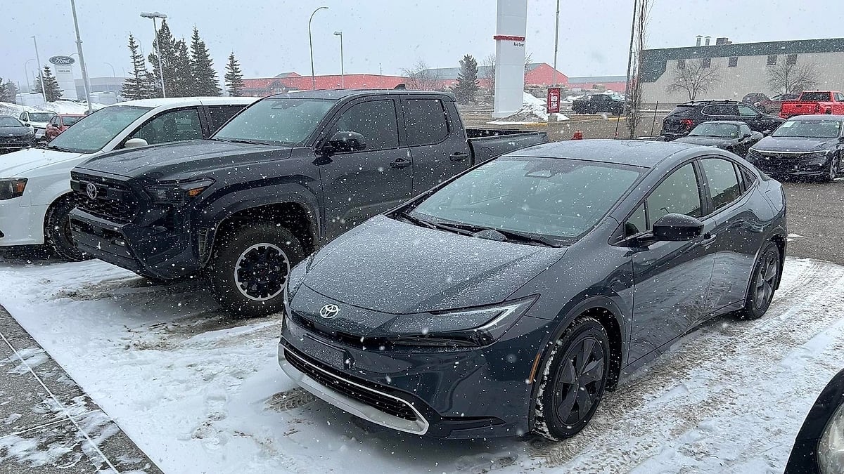 Jake Deutscher's 2025 Toyota Tacoma and 2026 Toyota Prius on the dealer's lot in Alberta, Canada