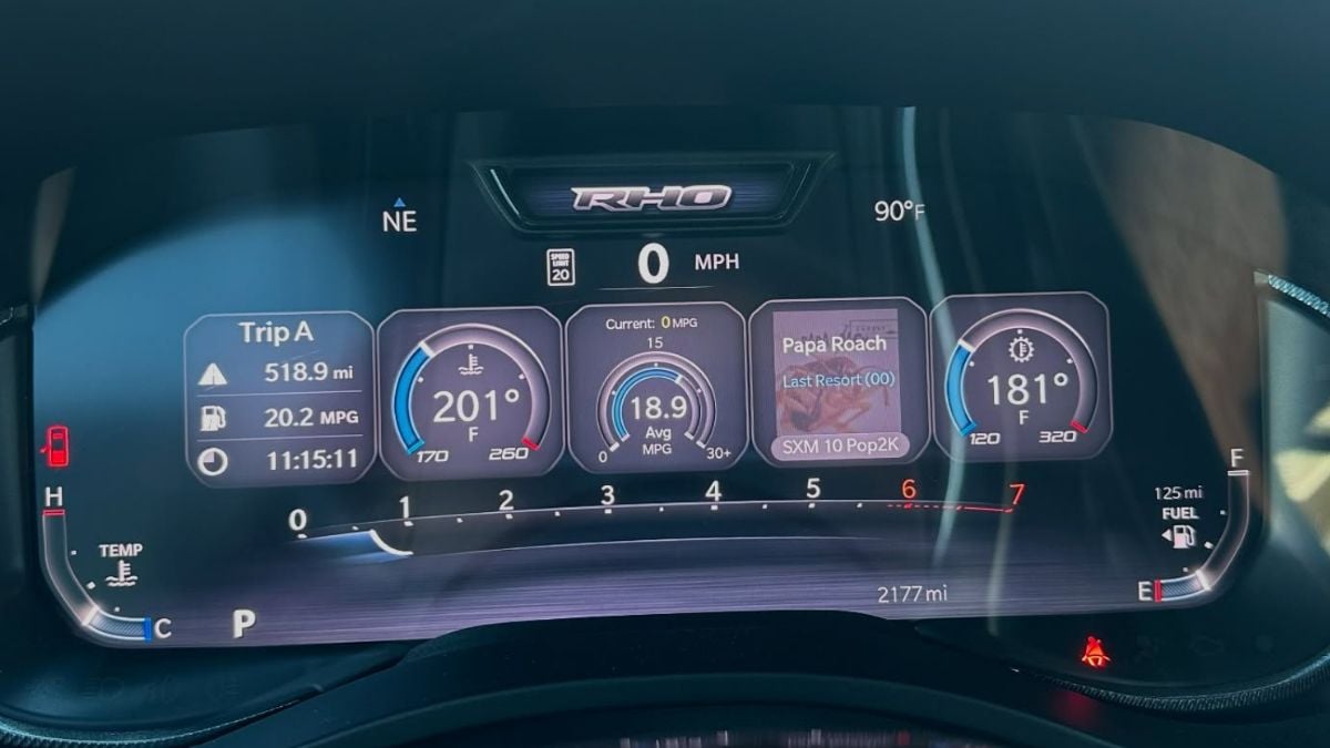 Ram 1500 RHO dashboard displaying 18.9 MPG, 201°F engine temp, trip details, and 90°F outside temp. Sleek and modern with digital gauges.
