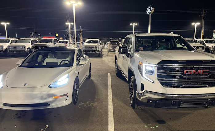 Justin's 2025 GMC Sierra and Tesla Model 3 