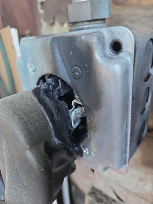 An EV charger receptacle is melted