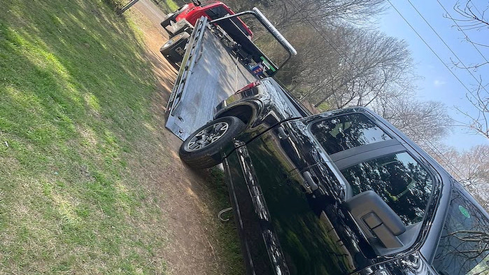 Kileigh's 2026 Ford F-150 2.7L being loaded on the tow truck