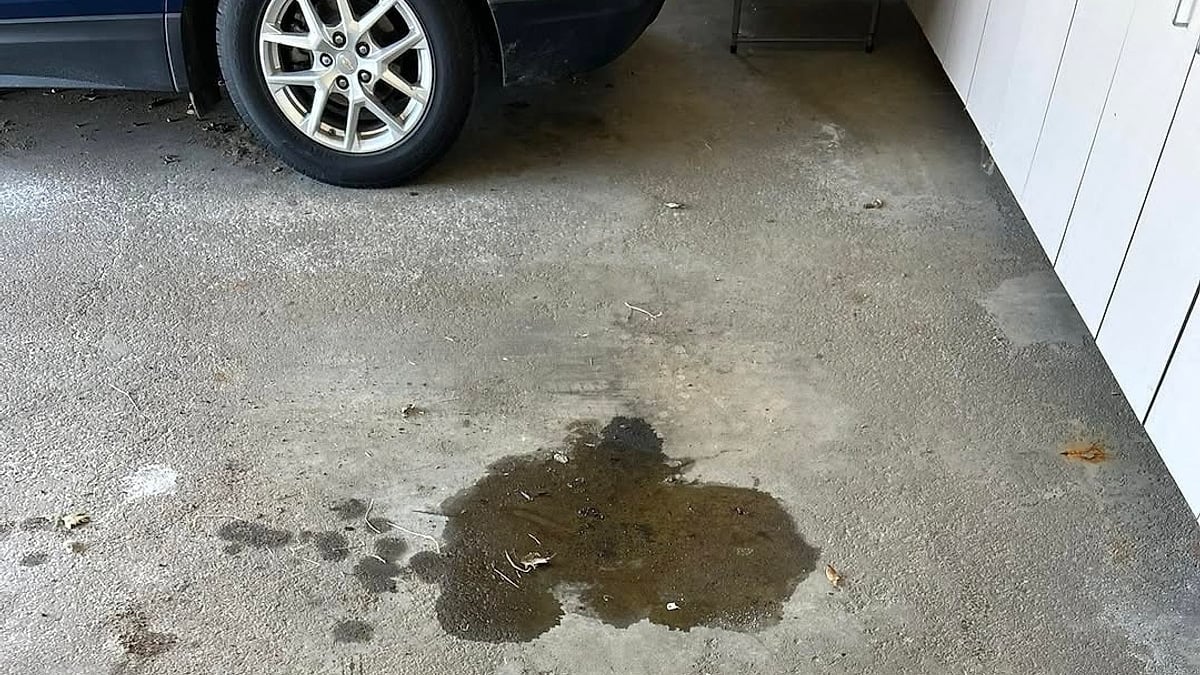 Matt Steele's 2019 Toyota Highlander parked in his garage next to a large oil spot on the floor