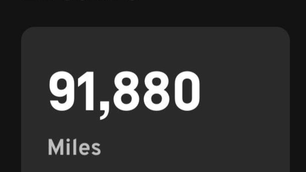App odometer display showing 91,880 miles in white text on a dark background.