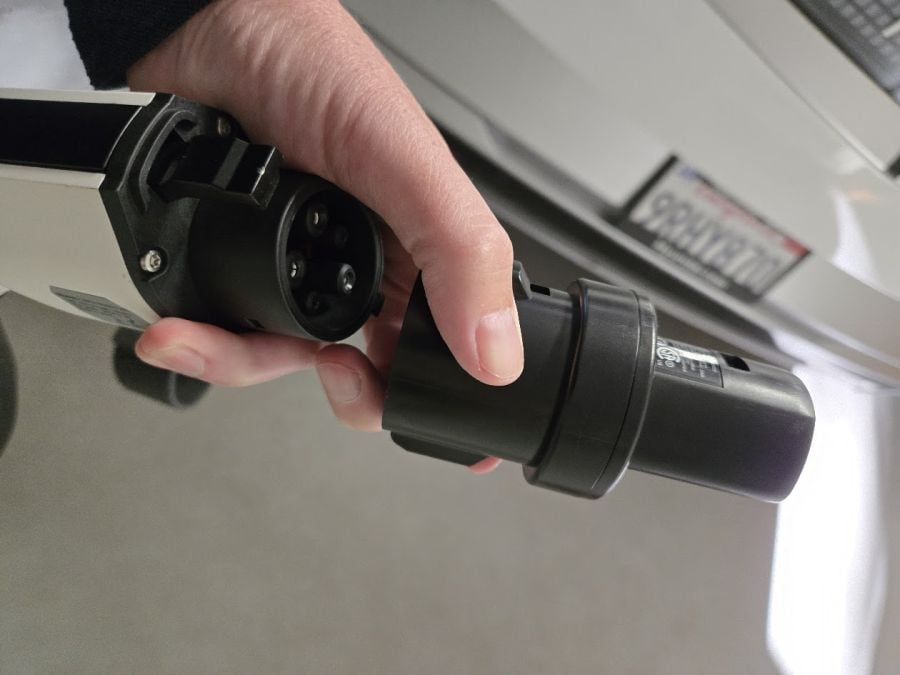 NACS to J-Plug adapter in use at charger