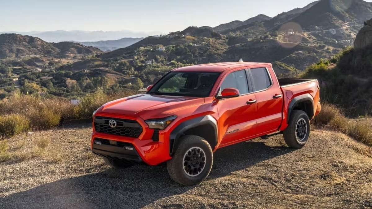 Red Toyota Tacoma on Dirt Road