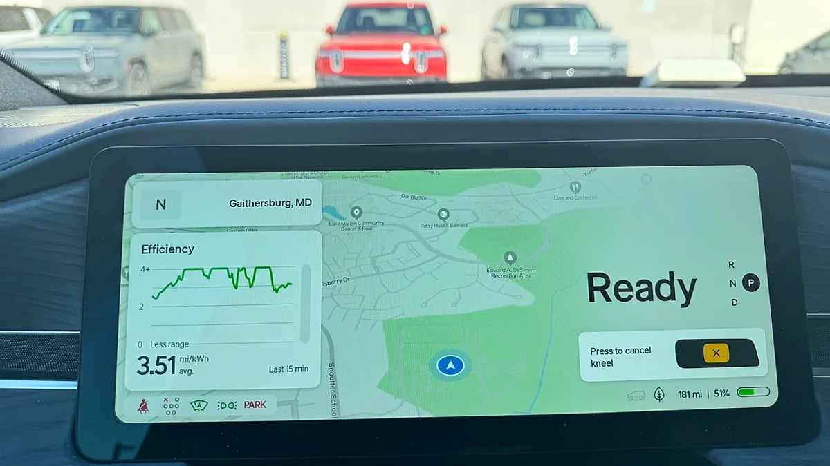 Rivian R1S interior display showing navigation map and efficiency statistics of 3.51 miles per kWh near Gaithersburg Maryland