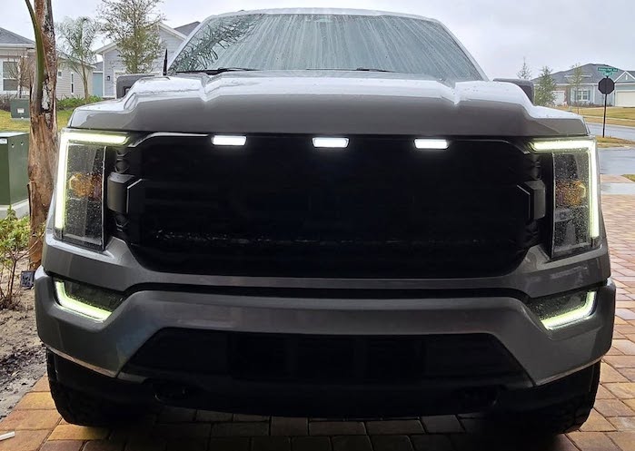 Ron Vic's Ford F-150 being serviced in the driveway 