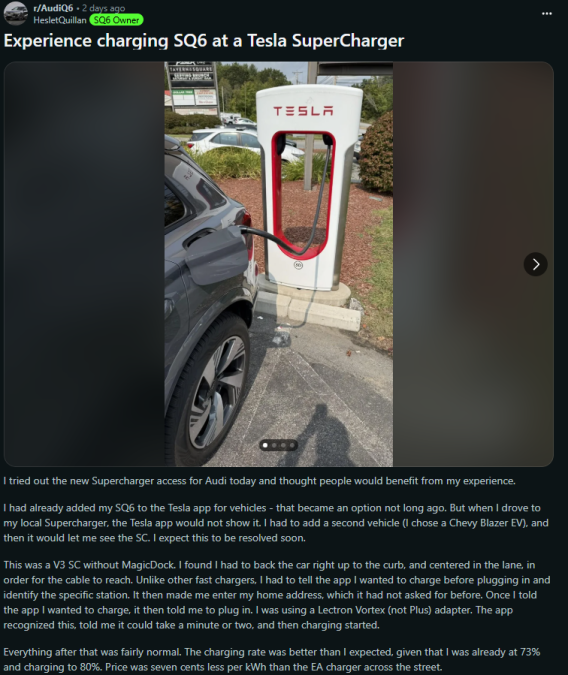 A close-up of a Tesla Supercharger station with an Audi SQ6 parked nearby, ready to charge amidst a landscaped area.