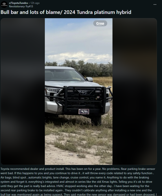 A white Toyota Tundra with a black heavy-duty front brush guard and LED lights, shown from a front three-quarter view in an outdoor setting.