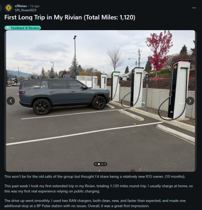 Screenshot of a Reddit post titled ‘First Long Trip in My Rivian (Total Miles: 1,120)’ showing a gray Rivian R1S SUV parked at a Rivian fast-charging station with multiple chargers. The background includes fall trees, mountains, and a suburban area. The post text describes the driver’s first long-distance EV road trip and positive charging experience.