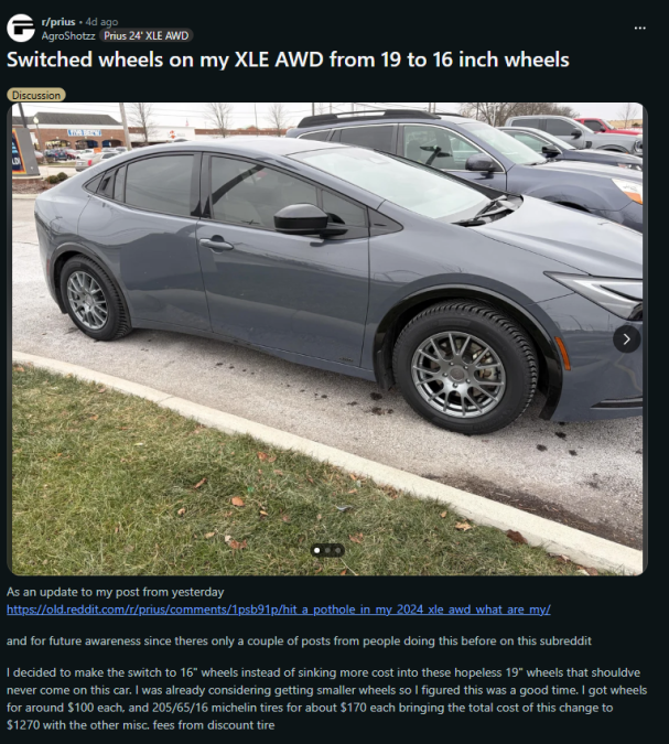 2024 Toyota Prius XLE AWD parked in a lot with aftermarket 16-inch wheels installed, showing a switch from factory 19-inch wheels for improved durability and ride comfort.